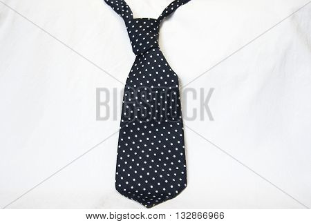 isolated blue polka dot necktie on white background