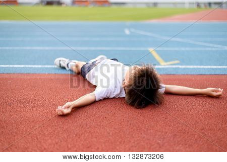 Boy Lay On The Running Track