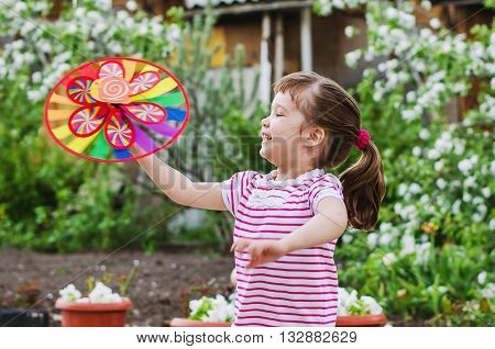 little girl having fun on a summer evening on the dacha
