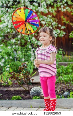 little girl having fun on a summer evening on the dacha