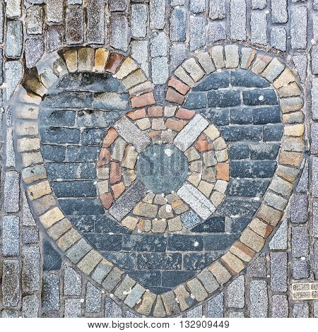 The Heart of Midlothian built into the cobblestones of Edinburgh's Royal Mile in the nineteenth century. It is considered good luck to spit on the heart as you pass.