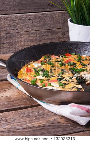 Frittata With Spinach, Tomatoes And Cheese