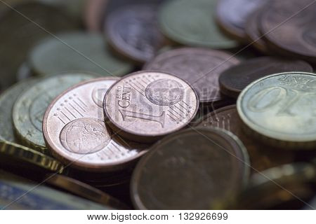 A closeup of euro cent coins in a cup
