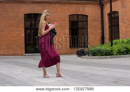 Young Pretty Blond Girl With Phone