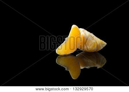 two small fresh orange slice with reflection