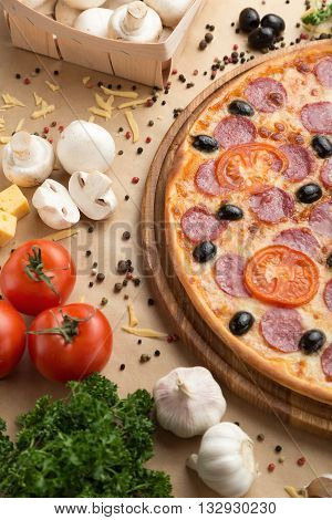 Delicious pizza served on table with vegetable