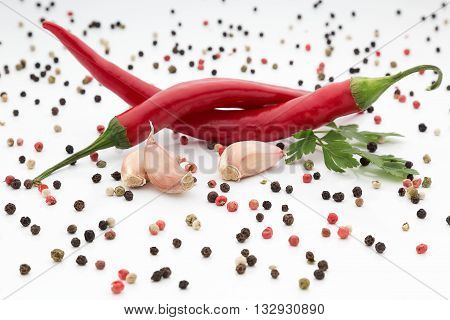 fresh chilli pepper with garlic on white