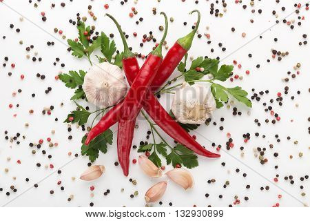 fresh chilli pepper with garlic on white