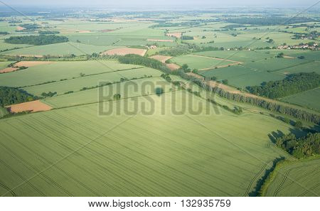 view over the early summer green fields from hot air balloon; East Anglia; UK