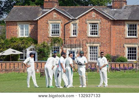 Hartley Wintney, HAMPSHIRE/UK- JUNE 5TH 2016 :Village cricket being played at Hartley Wintney in Hampshireon June 5th 2016. Unidentified people.