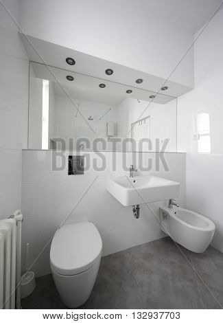 white small but elegant half bathroom interior