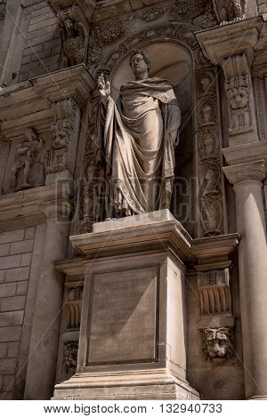 Milan Italy - May 25 2016: Giureconsulti palace. Sculpture Sancti Ambrosii. The sculpture is located in an alcove and ornate.