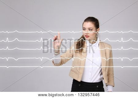 Doctor woman working with cardiogram lines