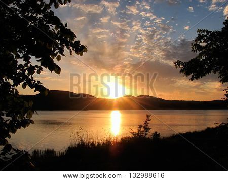 beautiful calm sunrise over the river and trees