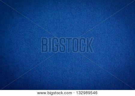 Dark blue fabric texture background with lomo effect