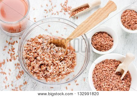 Medium-grain uncooked red Matta (Devzira) rice close up organic food background selective focus