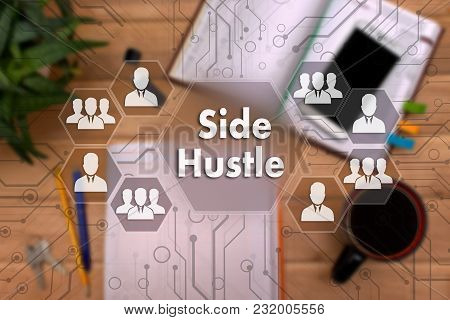 Side Hustle On The Touch Screen To The Network, On Office Background Blur.concept Of Side Hustle