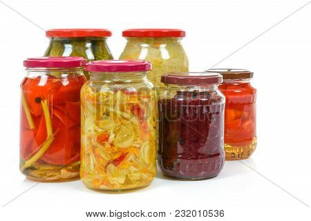 Jars With Variety Of Homemade Pickled Vegetables Isolated On A White Background.