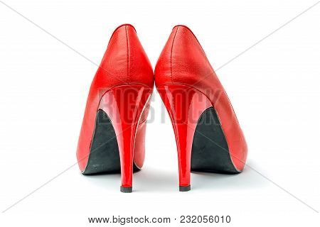 Red High Heel Shoes In Front Of White Clean Background With Shadows