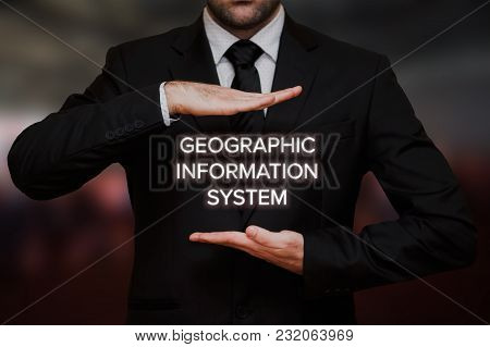 Geographic Information System (gis) Concept Text Between Hands Of The Businessman, Blurry Bokeh Back