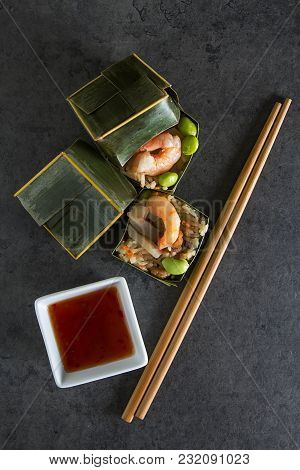 Prawn Parsels With Shrimps In Banana Leaves. Dark Background. Asian Cuisine