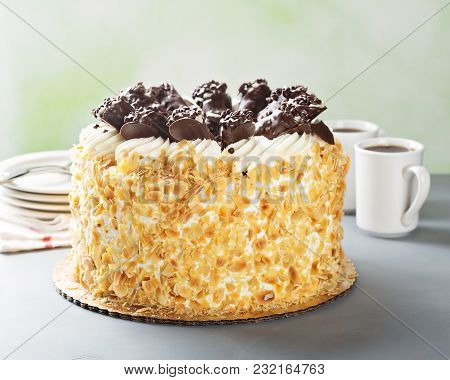 Italian Layered Almond Cake With Chocolate Cannoli On Top