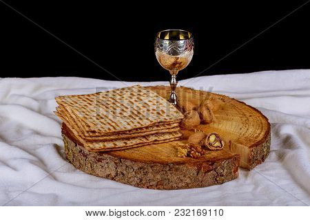 Jewish Symbols For The Passover Holiday Concept With Wine And Matzoh Over Rustic Background With Cop