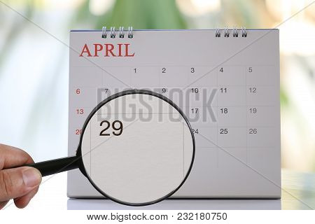 Magnifying Glass In Hand On Calendar You Can Look Twenty-nine Day Of Month,focus Number Twenty-nine 