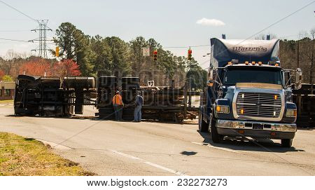 March 10, 2017: Carrboro Nc Usa-logging Truck Overturned On Highway With Logs
