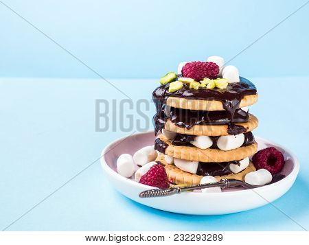 A Sweet Dessert Of A Chocolate Cookie Raspberry And Marshmallow Cup Of Coffee On A Light Blue Table