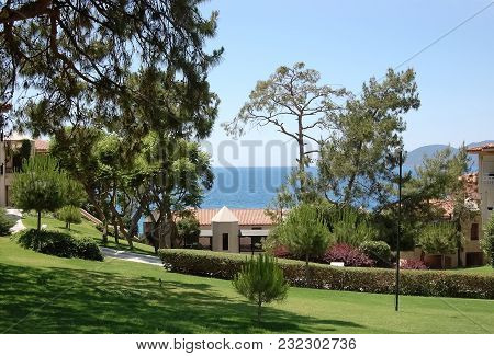 Oludeniz, Turkey - May 27, 2011: View Of The Green Territory, Pines And The Blue Sea In The Hotel Li