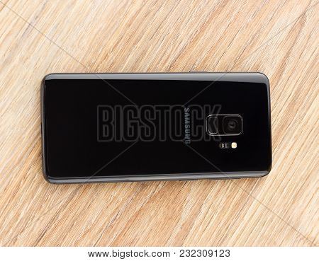 March 2018. Samsung Galaxy S9 is on the table. A new smartphone from the Samsung company lies on the wooden table with the camera up.