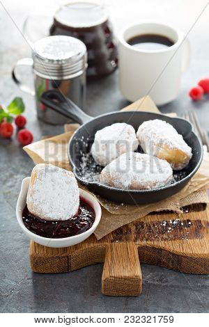 Beignets With Powdered Sugar And Raspberry Jam