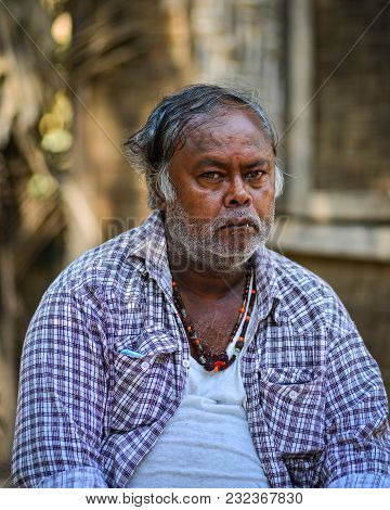 Mandalay, Myanmar - Feb 11, 2017. Portrait Of Burmese Man At The Street Market In Mandalay, Myanmar.
