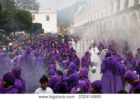 Antigua, Guatemala: March 18 2018: Priest In Incense Smoke In Front Of Float At The Procession San B