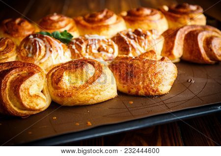 Sweet Buns With Jam And Cream On A Baking Sheet