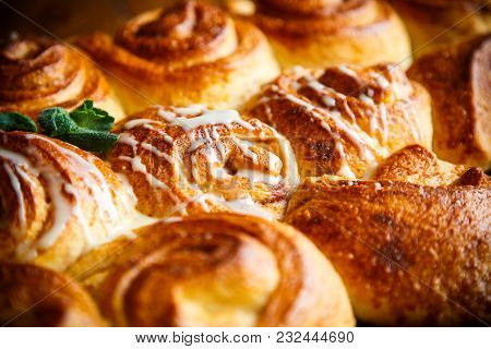 Sweet Buns With Jam And Cream On A Baking Sheet
