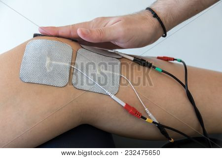Electronic Therapy On Knee Used To Treat Pain. Selective Focus