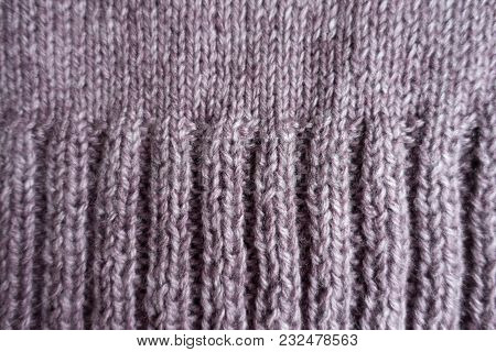 Ribs On The Edge Of Puce Knitted Fabric