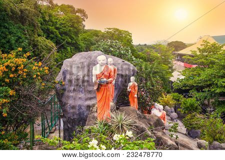  Buddhist Monk statues in Dambulla Cave Temple , Dambulla,  Sri Lanka. 