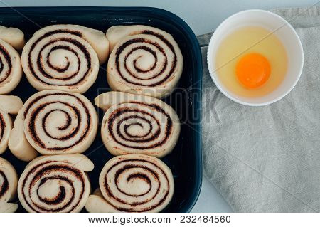 Cinnamon Rolls Or Cinnabon Handmade Raw Dough Preparation With Spices. Sweet Homemade Pastry Christm