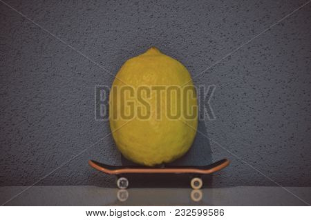 Skateboarding Yellow Lemon With A Dark Background