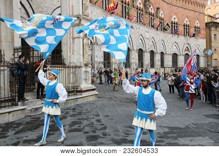 Siena, Italy - May 3, 2015: Contrada Wave Parade Marches In Siena, Italy. There Are Famous 17 Contra