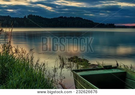 Rowboat On Beautiful Lake With Dramatic Sunset.the Morning Of The Loch.landscape With Boat.a Fishing