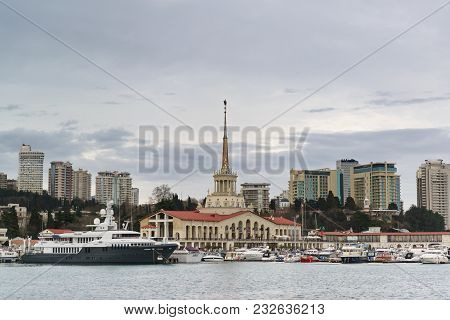 The Naval Station And Moored Boats On The Backdrop Of The City Skyscrapers On A Cloudy Spring Evenin