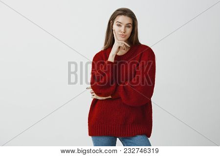 Portrait Of Indifferent Unimpressed Attractive Feminine European Female In Stylish Loose Sweater, Ho