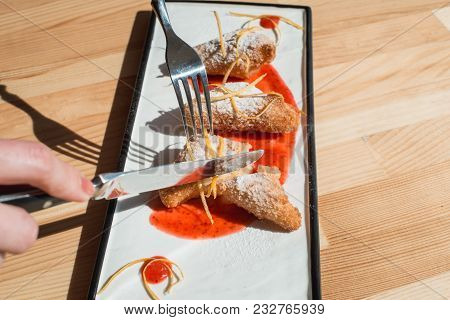 Womans Hands Slices Dessert Leche Frita , Decorated With Jam Close-up On A Plate. Spanish Cousine. W