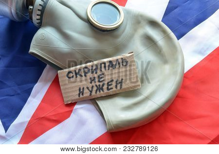 ILLUSTRATIVE EDITORIAL. The scandal about poisoning of former spy Sergei Skripal. Concept. Incription - Scripal no need (RUS).British Flag background.March 24, 2018 in Kiev,Ukraine