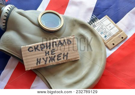 ILLUSTRATIVE EDITORIAL. The scandal about poisoning of former spy Sergei Skripal. Concept. Incription - Scripal no need (RUS).British Flag background.March 24, 2018 in Kiev,Ukraine