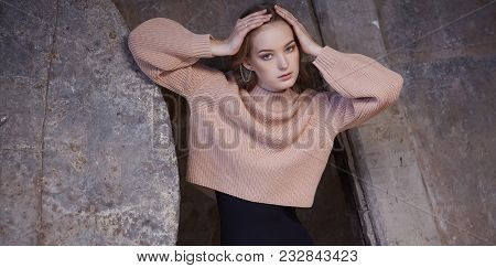 Stylish Woman In A Black Panties And Cream Pullover.